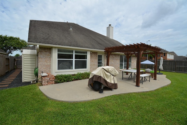 19026 Rustling Ridge Ln, Tomball, TX 77377 - rear view of property featuring a pergola, brick siding, a patio area, and a fenced backyard