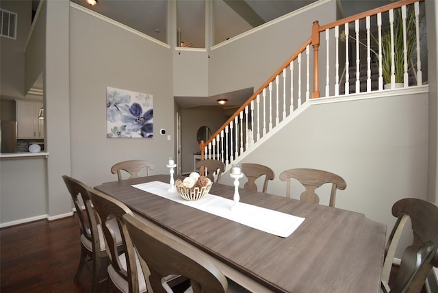 19026 Rustling Ridge Ln, Tomball, TX 77377 - dining area with a high ceiling, dark wood-type flooring, and stairs