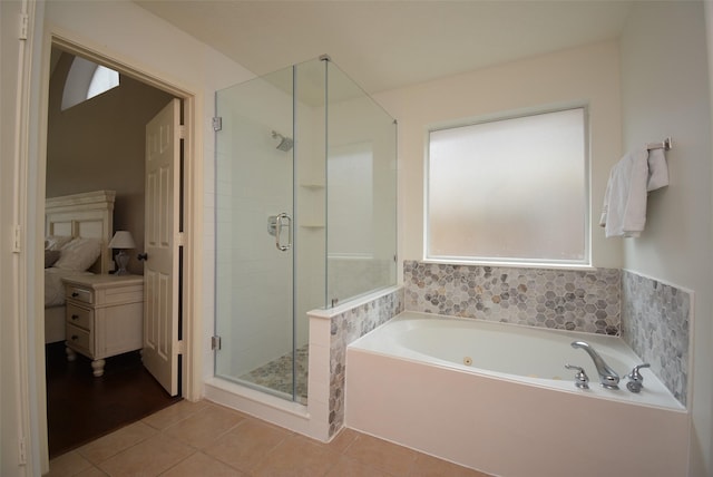 19026 Rustling Ridge Ln, Tomball, TX 77377 - bathroom featuring tile patterned flooring, a bath, and a shower stall
