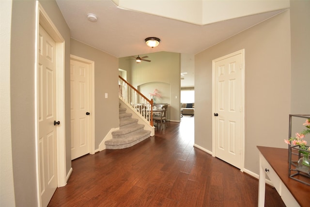 19026 Rustling Ridge Ln, Tomball, TX 77377 - hallway with stairs and dark wood finished floors
