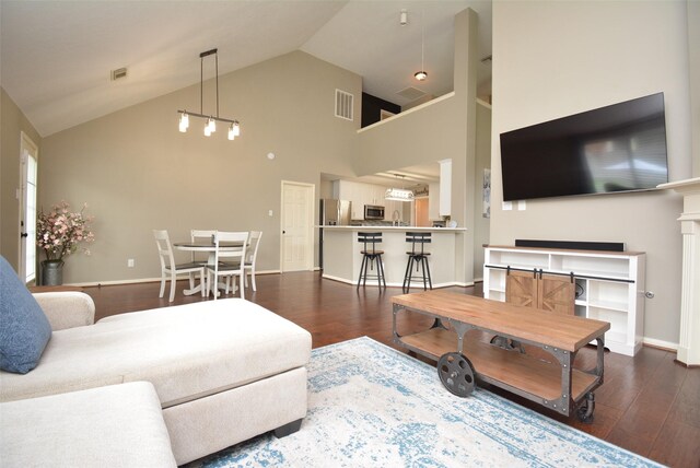 19026 Rustling Ridge Ln, Tomball, TX 77377 - living room featuring dark wood-type flooring and high vaulted ceiling