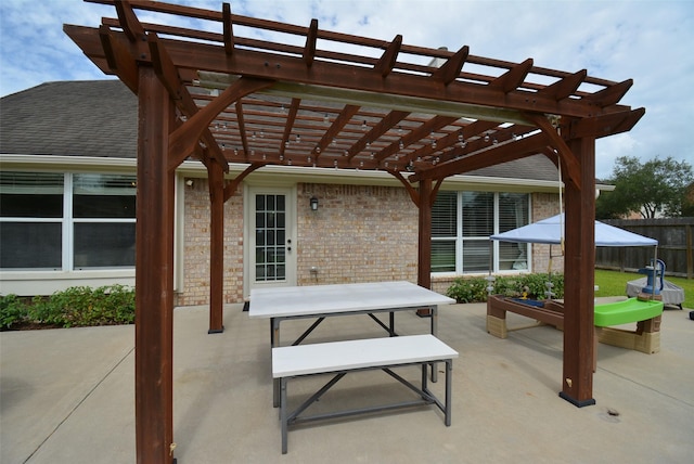 19026 Rustling Ridge Ln, Tomball, TX 77377 - view of patio featuring a pergola and outdoor dining area