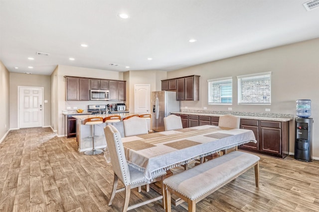 22624 Theodoli Dr, Katy, TX 77449 - dining space with light wood-type flooring, recessed lighting, and baseboards