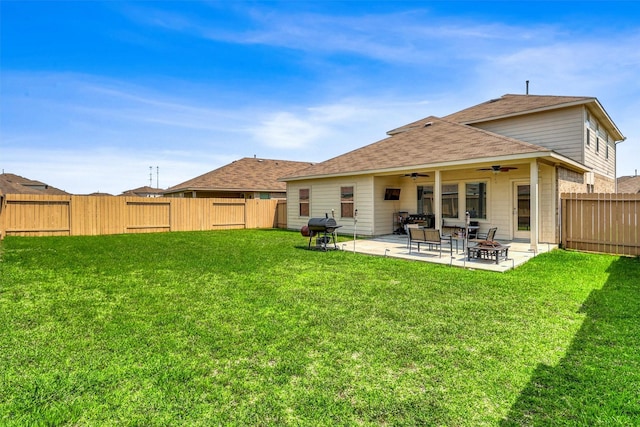 22624 Theodoli Dr, Katy, TX 77449 - back of house with ceiling fan, a fire pit, a patio area, and a shingled roof