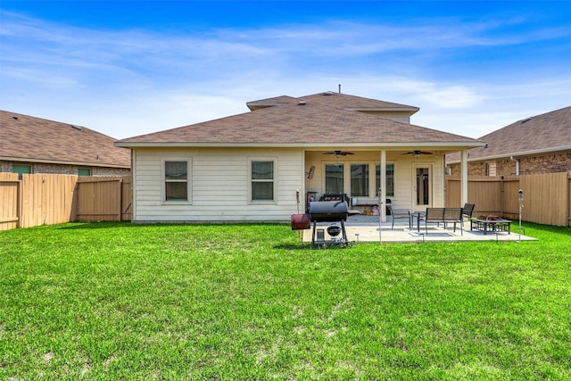 22624 Theodoli Dr, Katy, TX 77449 - back of property with ceiling fan, an outdoor fire pit, a patio, and roof with shingles
