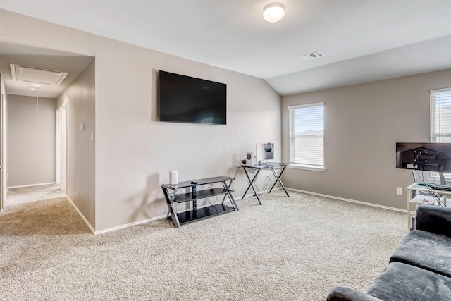 22624 Theodoli Dr, Katy, TX 77449 - living room featuring attic access, carpet floors, vaulted ceiling, and plenty of natural light