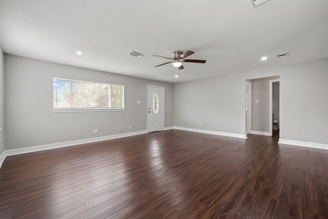 10134 Palestine St, Houston, TX 77029 - unfurnished living room featuring a ceiling fan, recessed lighting, baseboards, and dark wood-style flooring