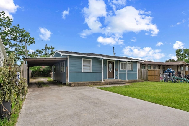 10134 Palestine St, Houston, TX 77029 - view of front facade featuring concrete driveway and a carport