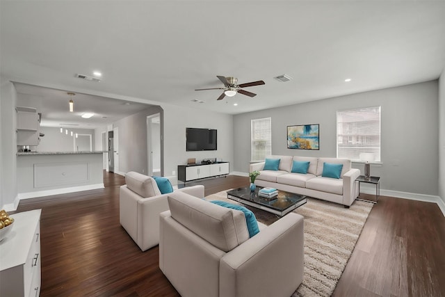 10134 Palestine St, Houston, TX 77029 - living room with a ceiling fan, baseboards, dark wood-style flooring, and recessed lighting