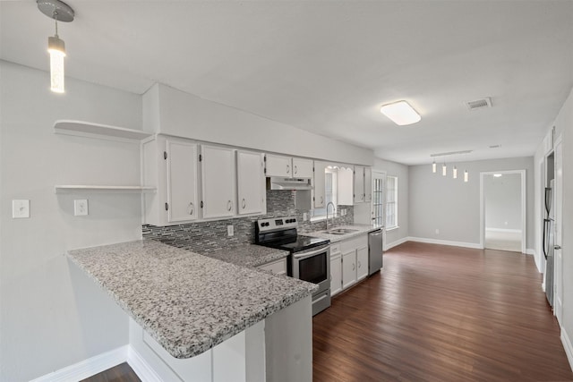 10134 Palestine St, Houston, TX 77029 - kitchen featuring stainless steel appliances, a sink, under cabinet range hood, open shelves, and backsplash