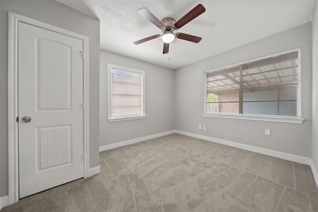 10134 Palestine St, Houston, TX 77029 - spare room with carpet floors, plenty of natural light, ceiling fan, and baseboards