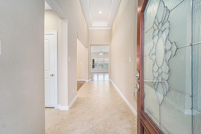 17127 Verde Park Ln, Cypress, TX 77433 - hall with light tile patterned floors, ornamental molding, a textured wall, baseboards, and a high ceiling