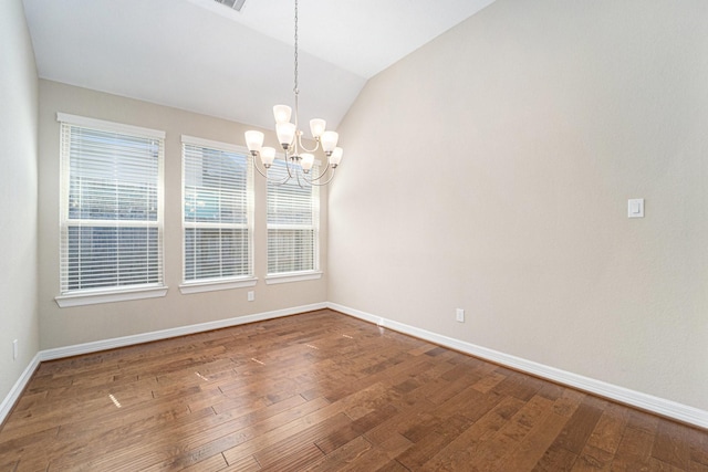 17127 Verde Park Ln, Cypress, TX 77433 - empty room featuring a chandelier, wood finished floors, baseboards, and vaulted ceiling