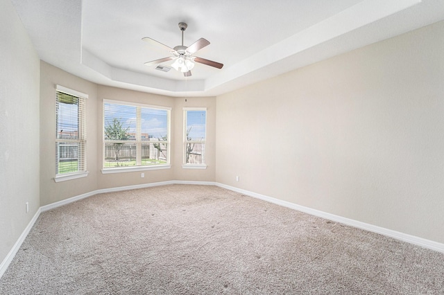 17127 Verde Park Ln, Cypress, TX 77433 - carpeted empty room featuring a ceiling fan, baseboards, and a raised ceiling