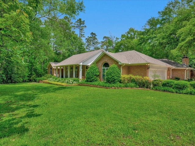 1908 Columbine Dr, Lufkin, TX 75904 - ranch-style house featuring an attached garage, a front lawn, brick siding, and a chimney