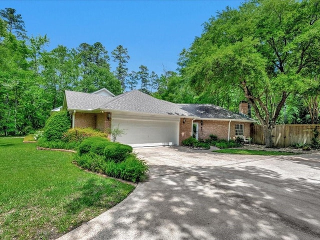 1908 Columbine Dr, Lufkin, TX 75904 - ranch-style home with driveway, an attached garage, brick siding, and a chimney