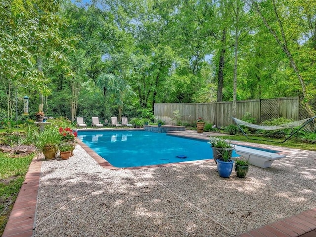 1908 Columbine Dr, Lufkin, TX 75904 - view of swimming pool with a patio and a diving board
