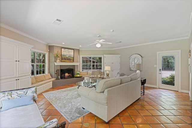 1908 Columbine Dr, Lufkin, TX 75904 - living room featuring light tile patterned floors, a ceiling fan, ornamental molding, a fireplace, and recessed lighting