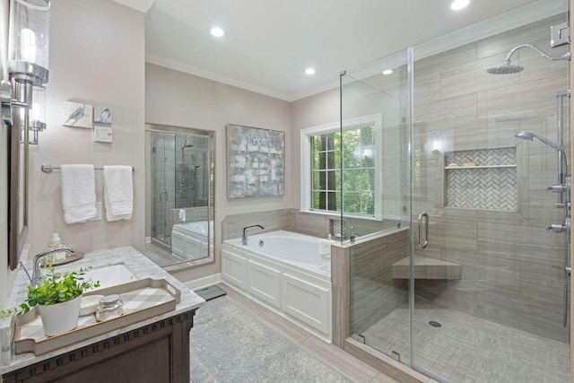 1908 Columbine Dr, Lufkin, TX 75904 - bathroom with a bath, vanity, a stall shower, ornamental molding, and recessed lighting
