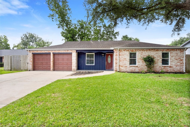 5000 Old Castle Ln, Dickinson, TX 77539 - ranch-style house featuring a garage, driveway, board and batten siding, a shingled roof, and brick siding