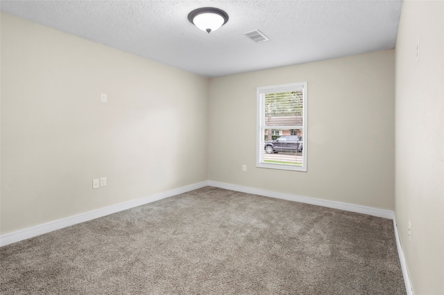 5000 Old Castle Ln, Dickinson, TX 77539 - empty room with carpet, a textured ceiling, and baseboards