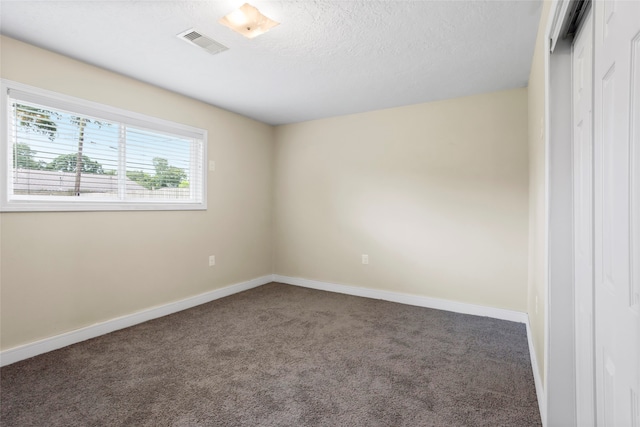 5000 Old Castle Ln, Dickinson, TX 77539 - carpeted empty room featuring baseboards and a textured ceiling