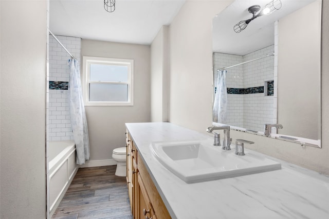 5000 Old Castle Ln, Dickinson, TX 77539 - bathroom with vanity, wood finished floors, toilet, and shower / tub combo