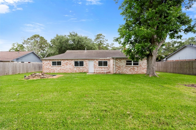 5000 Old Castle Ln, Dickinson, TX 77539 - rear view of house with brick siding and roof with shingles