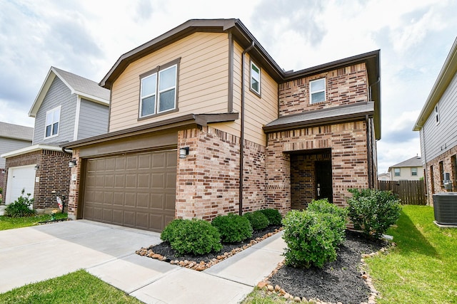 4827 Ranleagh Ct, Katy, TX 77493 - view of front facade with brick siding, an attached garage, concrete driveway, and central air condition unit