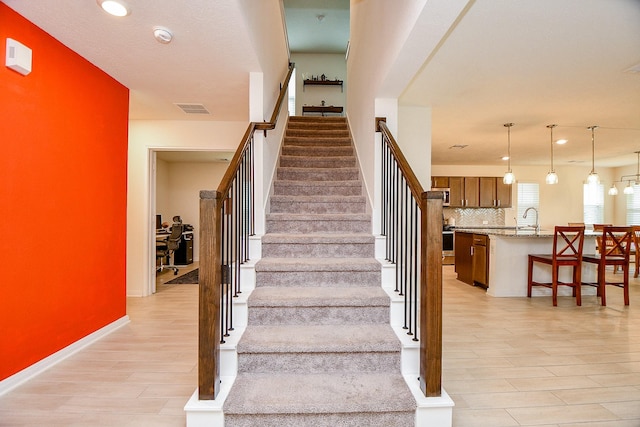 4827 Ranleagh Ct, Katy, TX 77493 - stairs with wood finished floors, recessed lighting, and baseboards