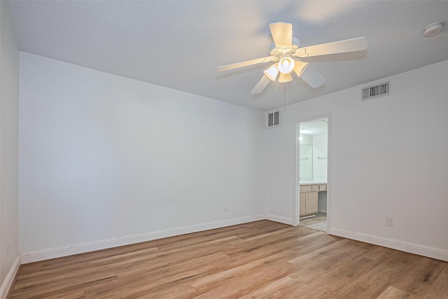 2750 Holly Hall St Unit 910, Houston, TX 77054 - empty room featuring light wood-type flooring, a smoke detector, baseboards, and ceiling fan