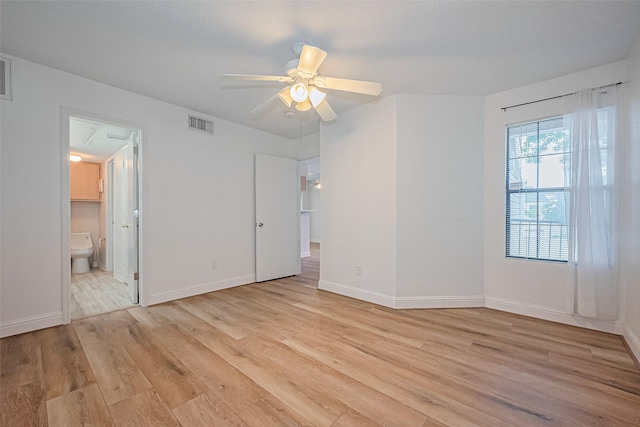 2750 Holly Hall St Unit 910, Houston, TX 77054 - unfurnished room featuring light wood-style floors, a ceiling fan, and baseboards