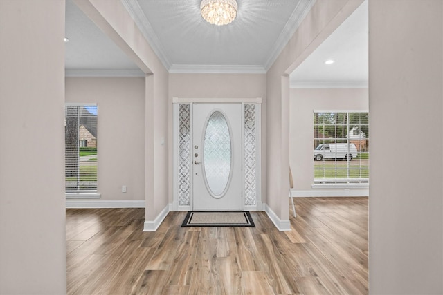 5523 Theall Rd, Houston, TX 77066 - entryway featuring a chandelier, wood finished floors, baseboards, and crown molding