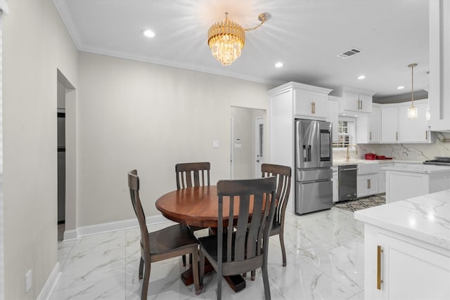5523 Theall Rd, Houston, TX 77066 - dining space featuring recessed lighting, a chandelier, light marble finish flooring, crown molding, and baseboards