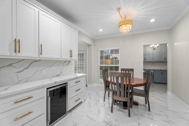 5523 Theall Rd, Houston, TX 77066 - dining area with wine cooler, a chandelier, light marble finish floors, recessed lighting, and ornamental molding