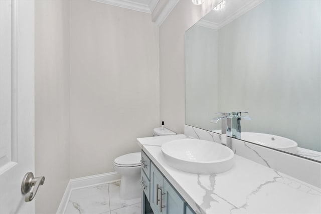 5523 Theall Rd, Houston, TX 77066 - bathroom with marble finish flooring, crown molding, vanity, toilet, and baseboards