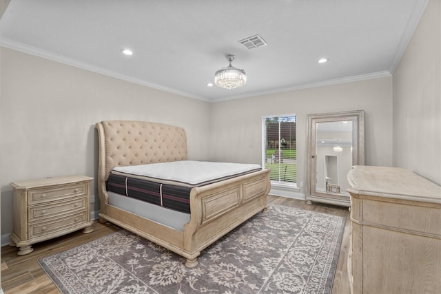 5523 Theall Rd, Houston, TX 77066 - bedroom featuring wood finished floors, ornamental molding, recessed lighting, access to exterior, and a chandelier