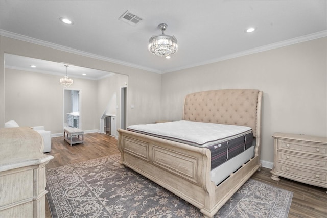 5523 Theall Rd, Houston, TX 77066 - bedroom featuring a chandelier, dark wood-style flooring, baseboards, recessed lighting, and ornamental molding