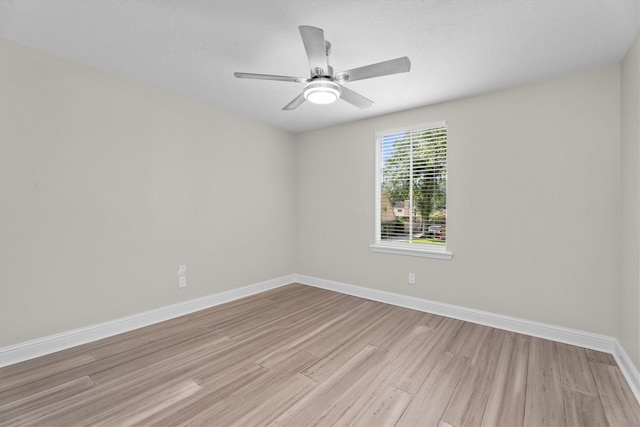 5523 Theall Rd, Houston, TX 77066 - unfurnished room featuring light wood-style floors, baseboards, and ceiling fan