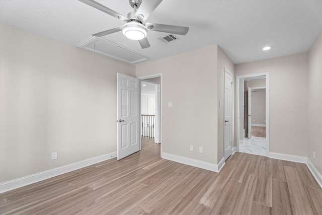 5523 Theall Rd, Houston, TX 77066 - unfurnished bedroom featuring attic access, light wood-type flooring, baseboards, recessed lighting, and a ceiling fan
