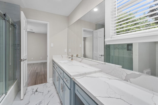 5523 Theall Rd, Houston, TX 77066 - full bath featuring double vanity, baseboards, marble look tile flooring, and recessed lighting