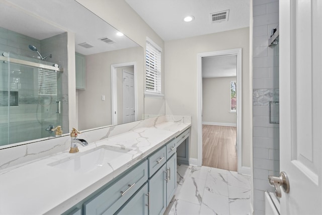 5523 Theall Rd, Houston, TX 77066 - bathroom featuring baseboards, a shower with door, vanity, recessed lighting, and marble finish flooring