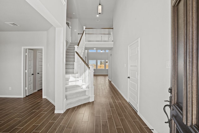 32415 Tallow Creek Dr, Waller, TX 77484 - foyer entrance with stairway, baseboards, dark wood-style flooring, and a high ceiling