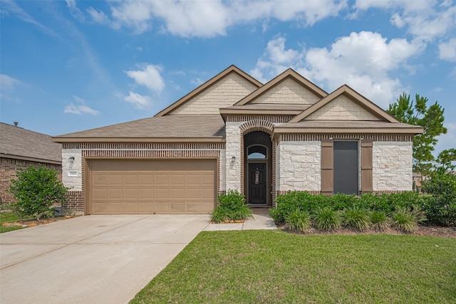 15602 Clearwater Bend Dr, Houston, TX 77044 - french provincial home featuring a front lawn, an attached garage, driveway, brick siding, and stone siding