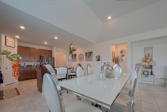 15602 Clearwater Bend Dr, Houston, TX 77044 - dining space featuring recessed lighting, lofted ceiling, and light tile patterned floors