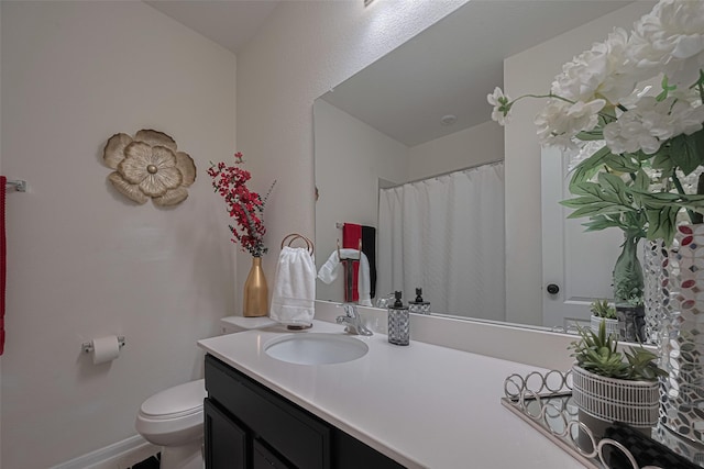 15602 Clearwater Bend Dr, Houston, TX 77044 - bathroom featuring toilet, vanity, and baseboards