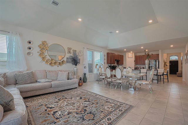 15602 Clearwater Bend Dr, Houston, TX 77044 - living room with light tile patterned flooring, recessed lighting, and vaulted ceiling