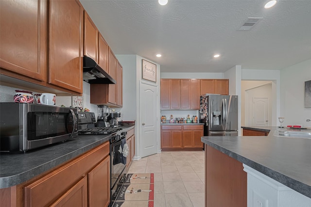 15602 Clearwater Bend Dr, Houston, TX 77044 - kitchen featuring appliances with stainless steel finishes, under cabinet range hood, recessed lighting, a sink, and dark countertops
