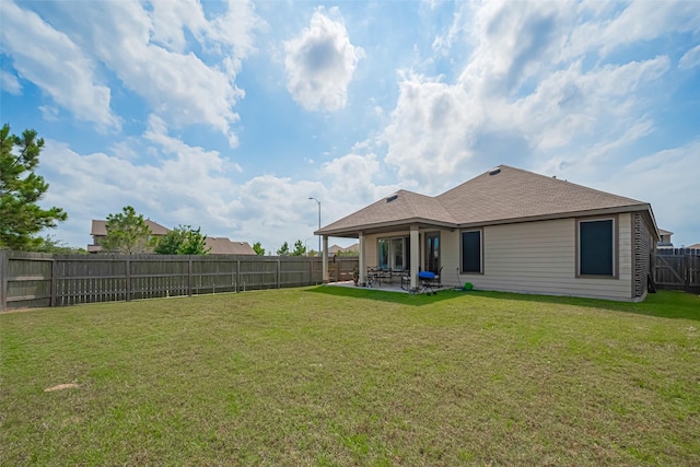 15602 Clearwater Bend Dr, Houston, TX 77044 - rear view of house with a patio area and a shingled roof