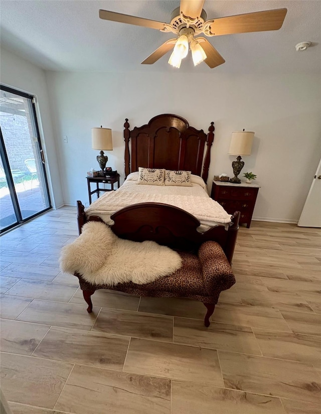 18526 Denise Dale Ln, Houston, TX 77084 - bedroom featuring access to outside, a ceiling fan, and baseboards
